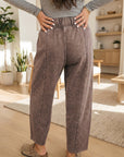 Model wearing Lola relaxed barrel pants, front view