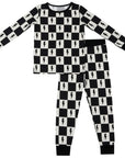 Black and white checkered pajama set with lightning bolt pattern on a white background