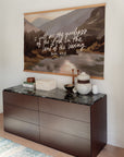 Goodness of God landscape canvas banner with magnetic wood frames displayed above a dark cabinet