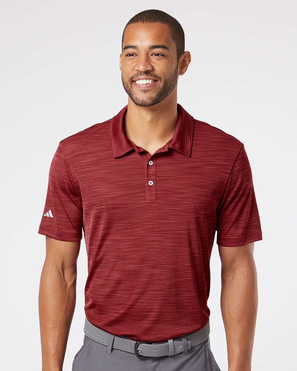 Adidas A402 Men’s Blend Polo made from recycled moisture-wicking fabric, shown with a modern fit and right-sleeve adidas logo. Ideal for custom printing