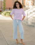 Model wearing Hayden blue striped jeans with a pink tee