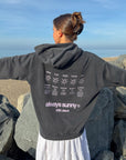 Back view of Always Sunny With Jesus hoodie styled with white pants