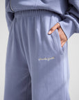 Basics Plum Wide Leg Sweatpants showing the elastic waistband, side pocket, and Elevated Faith embroidery