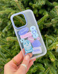 Be Joyful iPhone Case held against green foliage, showing pastel faith-inspired graphics and the camera opening