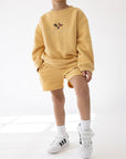 Better Days Butterfly New Wheat Kids’ Crewneck Sweatshirt