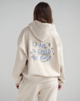 Back of the Child of God Heather Eggshell hoodie with blue lettering and playful illustrated accents
