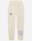 Beige sweatpants with a heart design and text on a white background
