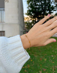 Cross Link Bracelet worn on a wrist outdoors