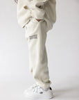 Moonstone kids sweatpants showing small leg lettering and gathered ankle cuffs