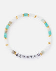 Bracelet with 'DEVOTED' beads on a white background