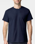 Male model wearing a navy Gildan Heavy Cotton T-Shirt with a classic fit and soft cotton feel — ideal for custom DTF printing and everyday wear by Lumiere Vive.