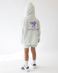 Back view of the God’s Plan Racing Icicle kids’ hoodie with a purple graphic and the hood up.