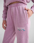 Close-up of God’s Promises Bordeaux sweatpants showing the elastic waistband, pocket, and colorful mountain graphic