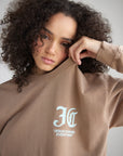 Close-up of the white chest graphic on the dune heavyweight long sleeve tee