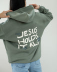 Jesus Holds It All Unisex Hoodie | Faith Based Relaxed Hoodie