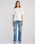 Full-length front view of the Jesus Loves New York heavyweight tee styled with jeans.