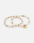 John 3:16 two-piece bracelet set with white beads, gold-tone accents, and a heart charm