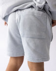 Back detail of the Open Air blue shorts showing the patch pocket.