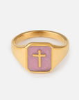 Lilac Enamel Cross Ring with a gold-tone band and raised cross on a lilac signet face
