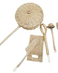 Set of wicker kitchen utensils including a whisk, ladle, and rolling pin on a white background