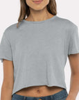 Woman wearing a grey Next Level Apparel Women’s Festival Crop Tee with a relaxed, lightweight fit — perfect for custom printing, events, and boutique designs by Lumiere Vive.