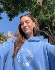 Close-up of the circular front graphic on the Not of This World Provence Blue Hoodie