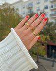 Gold-tone Open Heart Ring styled with a light knit sweater