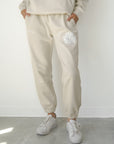 Our World Needs Jesus Beige Unisex Sweatpants