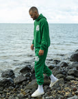 Our World Needs Jesus Green Sweatpants
