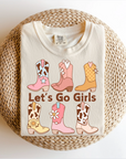 A women's adult t-shirt with a graphic print of cowboy boots and the text 'LET'S GO GIRLS' on a beige background.