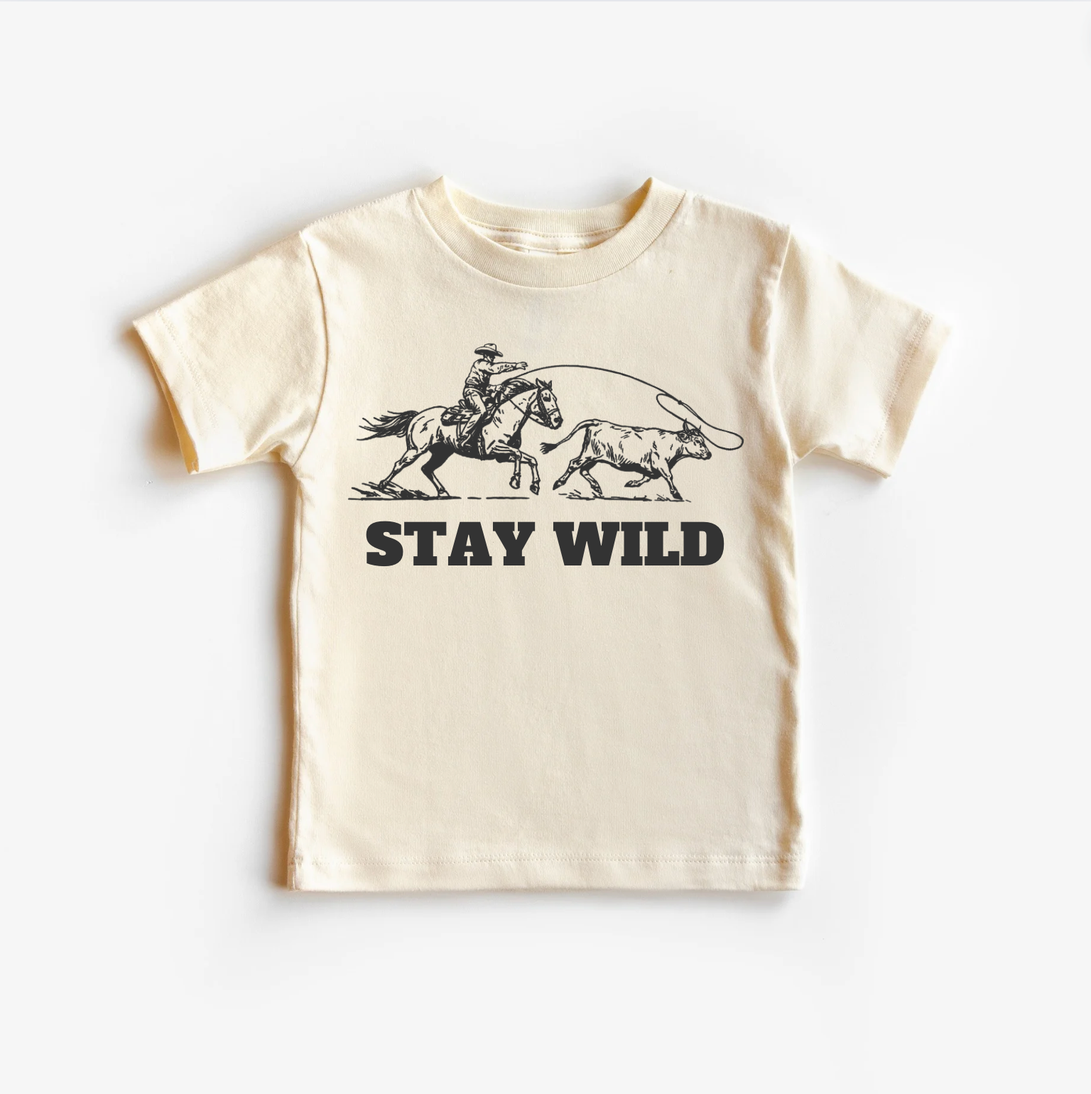 Neutral colored toddler t-shirt with 'Stay Wild' text and a cowboy and horse graphic.
