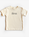 “Three” 3rd Birthday Tee – Neutral Toddler T-Shirt (Multiple Fits & Styles)