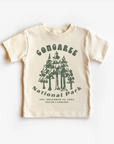 A beige unisex tee shirt top with 'Congaree National Park' and a tree graphic design.