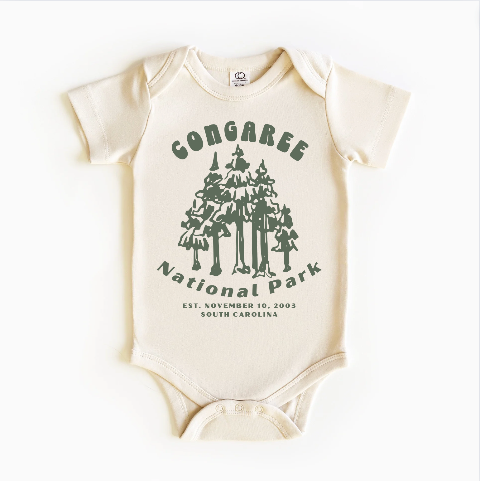 A white bodysuit with green trees and text that reads 'Congaree National Park, Established November 19, 2004, South Carolina'.