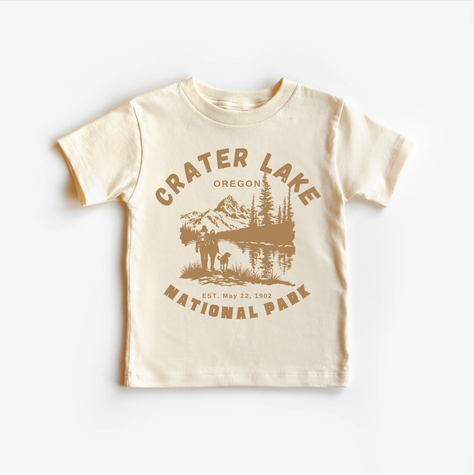 A beige unisex tee shirt with 'CRATER LAKE NATIONAL PARK OREGON' printed on the front.