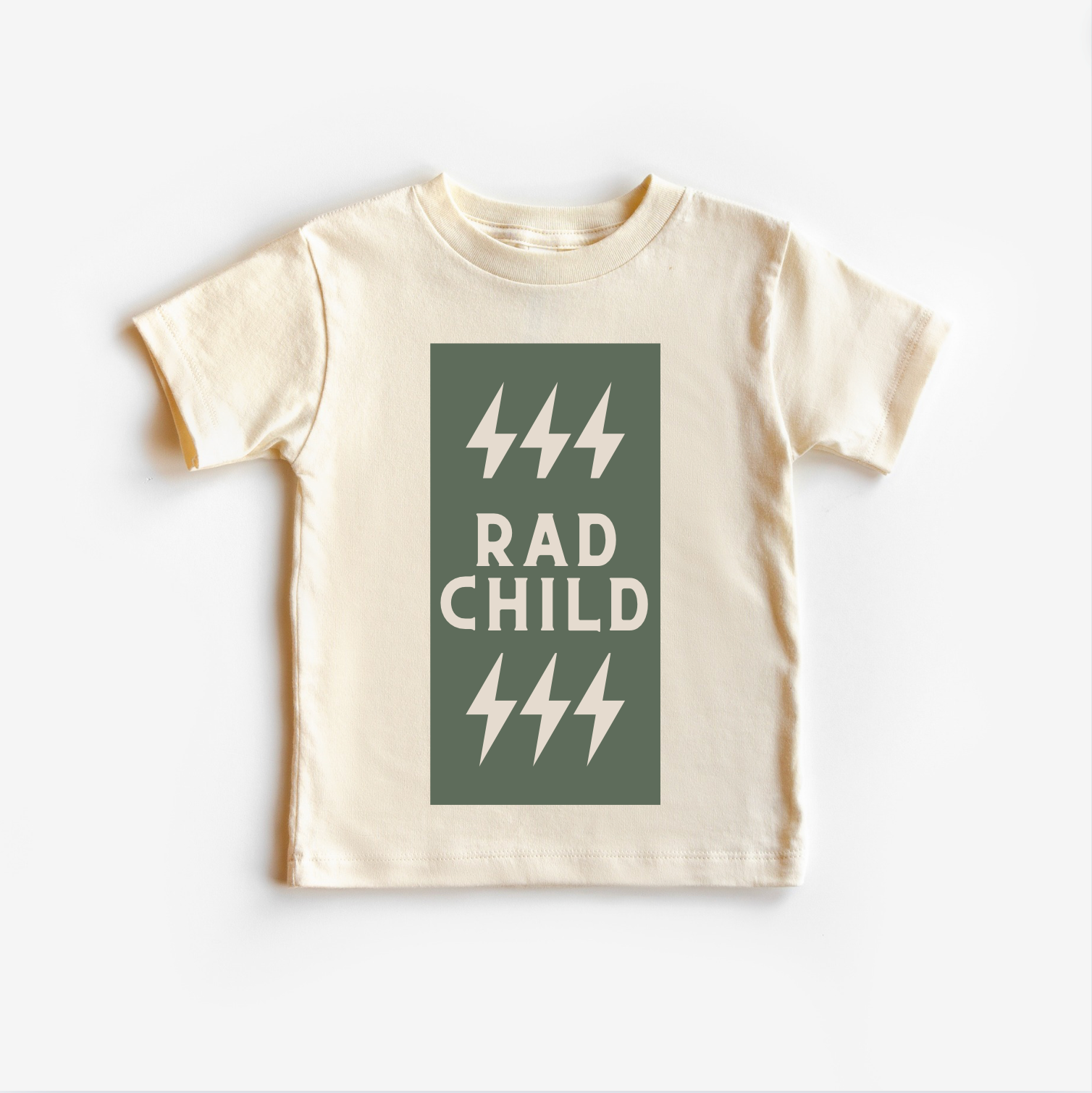 A light beige colored toddler's t-shirt with a green lightning bolt graphic on the front.