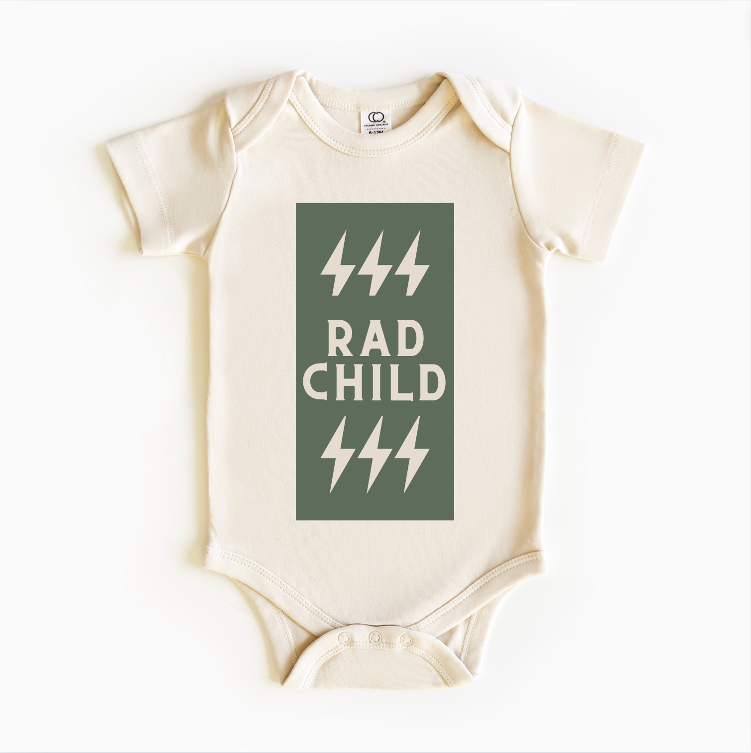 A gender-neutral baby bodysuit onesie in a beige color with a green text that reads 'RAD CHILD' and five green lightning bolts graphic.