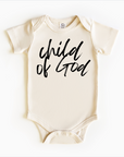 A gender neutral beige bodysuit onesie with the text 'Child of God' printed on the front.