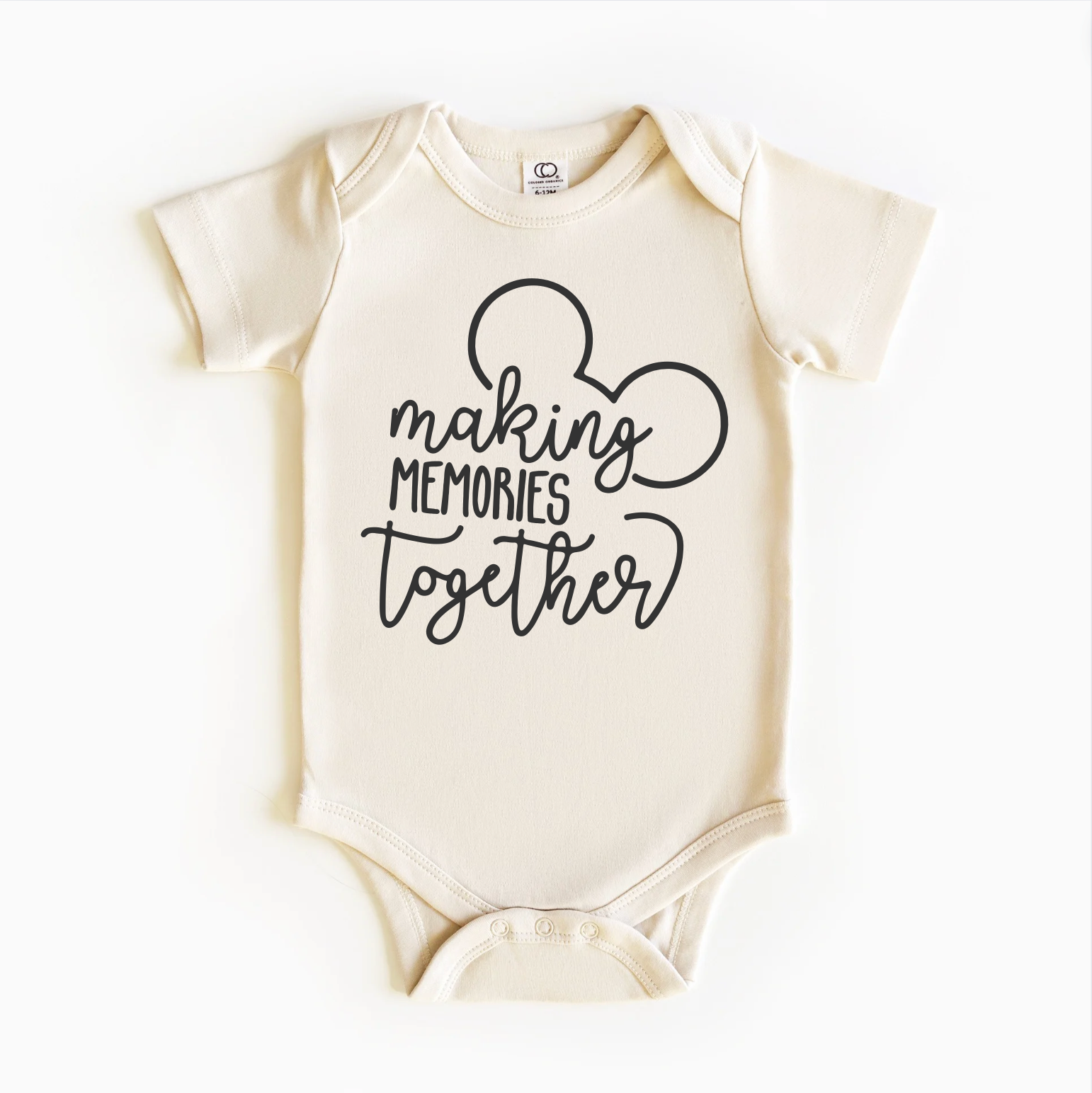 A beige bodysuit with black text and graphic design, depicting a pair of mouse ears and the phrase 'making memories together'.