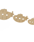 Three decorative submarine shapes on a white background