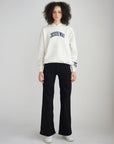 Full-length view of The Jesus Way White Down Hoodie styled with black pants