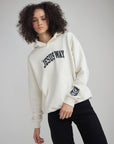 Angled front view of The Jesus Way White Down Hoodie showing its relaxed fit and kangaroo pocket
