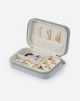Angled view of the open jewelry travel case showing necklace hooks, ring storage, and divided compartments
