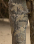 Close-up of The Sacrifice lettering on the camouflage sweatpants.