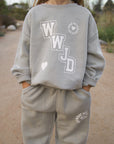 Front of WWJD kids’ sweatshirt with varsity lettering and heart graphic