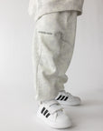 Side view of the white camo kids’ sweatpants showing the leg and cuff
