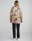 Back view of the oversized What a Friend in Jesus Camo Shacket styled with black pants.