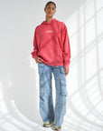 Full-length front view of Yahweh Ribbon Red Unisex Hoodie styled with blue jeans