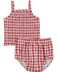 Red and white checkered baby outfit with top and bloomers on a white background