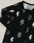 Black onesie with white geometric pattern on a light gray background